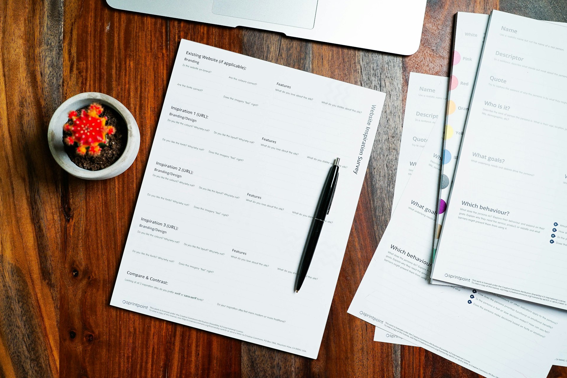 Property documents and a pen on a wooden desk